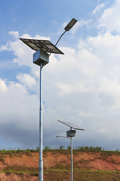 Close up of electric pole with Solar panel for lightning Close up of electric pole with Solar modules panel, use of Solar energy for lightning, Rio de Janeiro, Brazil concentrated solar power photos stock pictures, royalty-free photos & images