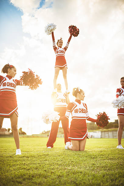 istock Happiness cheerleaders posing with pon-pon 471905939