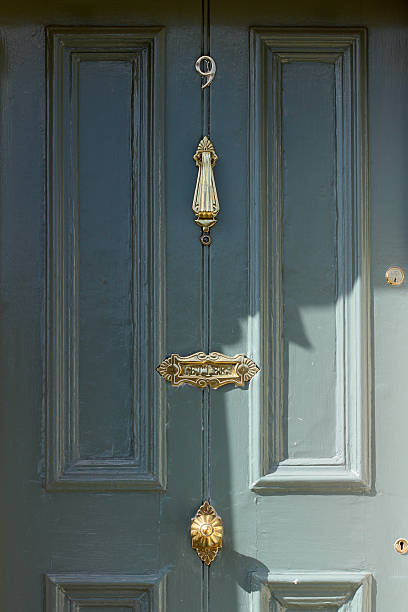 istock Green Door with bronze ornaments 471905984