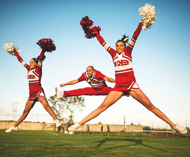 istock Jumping on mid air - cheerleaders team with pon-pon 471906121