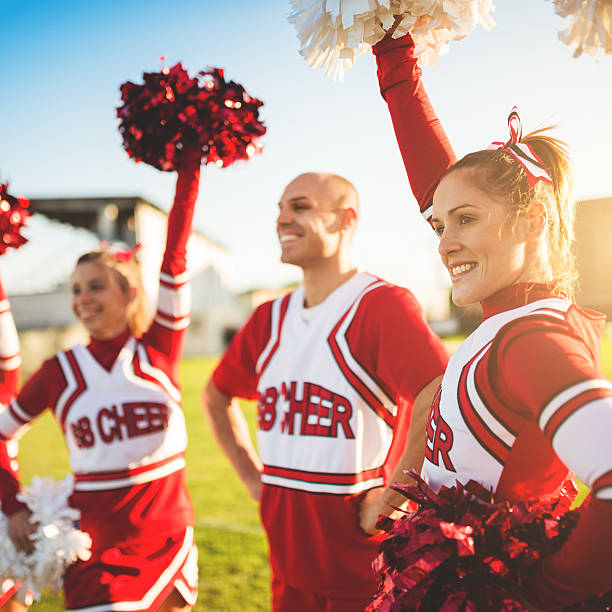istock Happiness cheerleaders posing with pon-pon 471906127