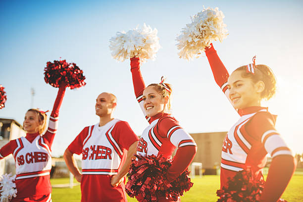 istock Happiness cheerleaders posing with pon-pon 471906131