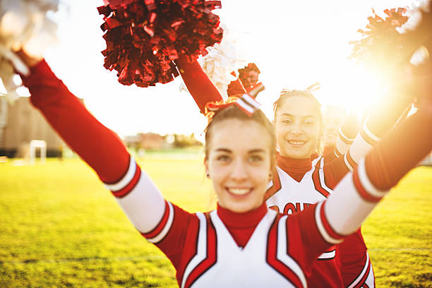 istock Happiness cheerleaders posing with pon-pon 471906197