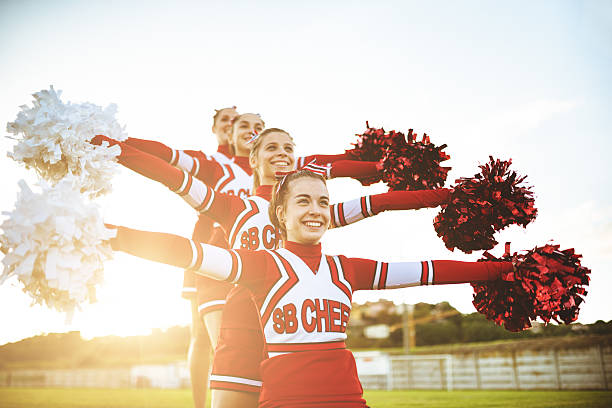Happiness cheerleaders posing with pon-pon http://blogtoscano.altervista.org/che.jpg  cheerleader photos stock pictures, royalty-free photos & images