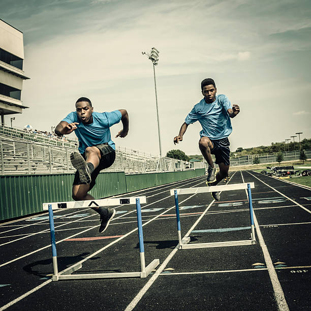 istock Young hurdle runners compete at the high scool race (III) 471906463