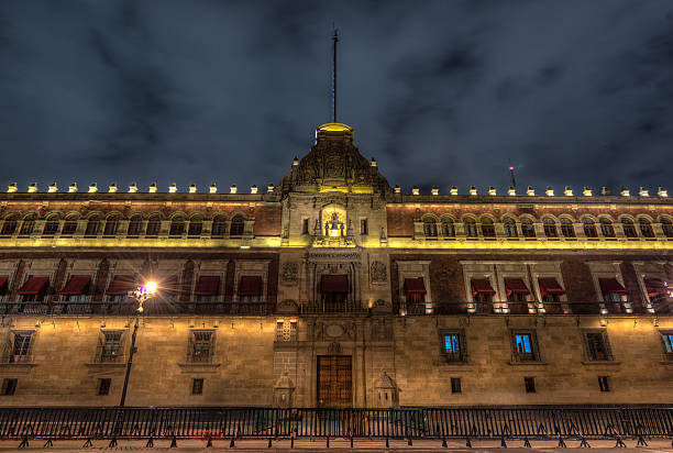 Illuminated National Palace in Plaza de la Constitucion of Mexico City at Night.