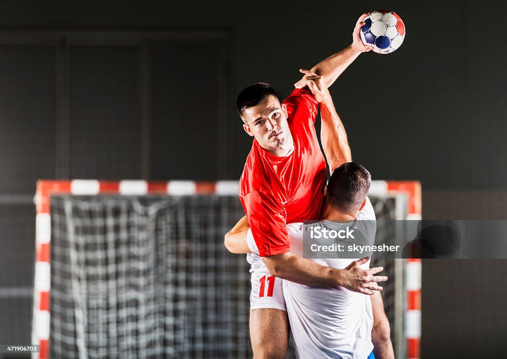 Handball players in action. Two handball players in action.   Team Handball Stock Photo