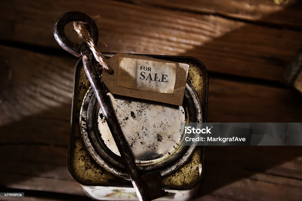 Home For Sale Real Estate Sign. Home For Sale Real Estate Sign. Label and key on wooden table, vintage, toned photo. 2015 Stock Photo