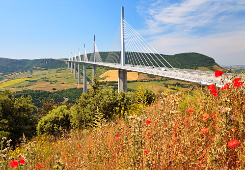 Millau, France - June 12, 2014: Morning shot of Millau Viaduct, a cable-stayed bridge that spans the valley of the River Tarn near Millau in Southern France.
