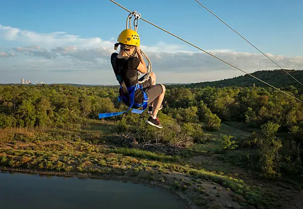 Young woman riding a Zipline Canopy Tour