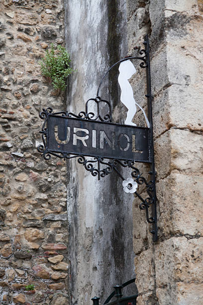 Old iron sign for toilet in Lisbon, Portugal stock photo