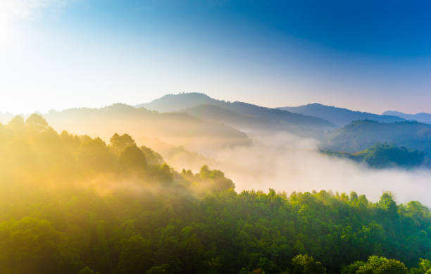 Beautiful sunshine at misty morning mountains . Beautiful sunshine at misty morning mountains at north thailand Fog stock pictures, royalty-free photos & images