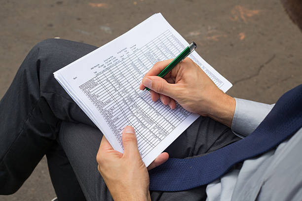 istock Hands of businessman with  notes and pen. 471911357