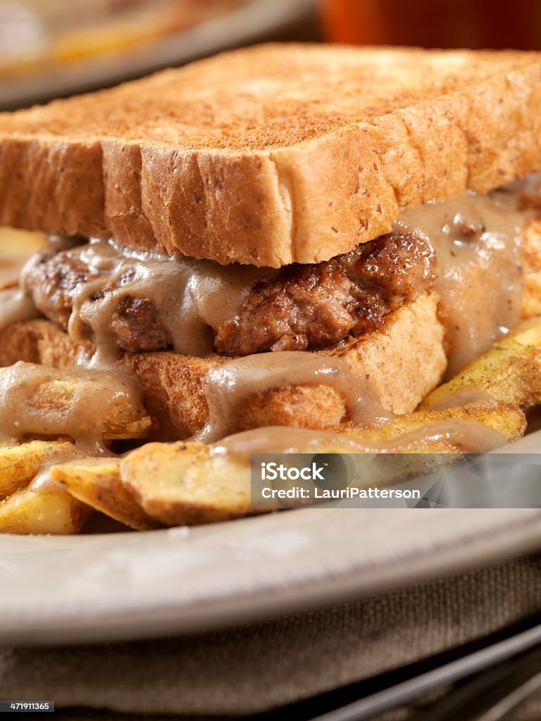 Hot Hamburger Sandwich Hot Hamburger Sandwich on Toasted Bread with Gravy and French Fries-Photographed on Hasselblad H3D2-39mb Camera Bar - Drink Establishment Stock Photo