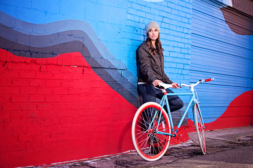 Young woman with a single speed bicycle.