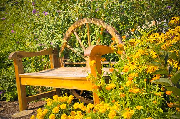 A cozy bench in a secret garden in summer.