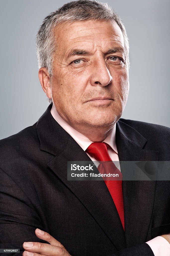 Business man smiling with arms crossed Headshot Stock Photo