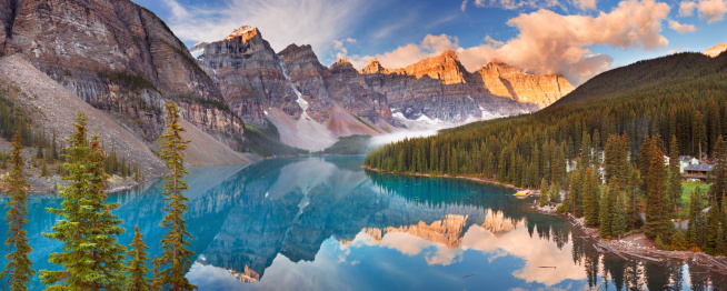 Beautiful Moraine Lake in Banff National Park, Canada. Photographed at sunrise. A seamlessly stitched panoramic image.