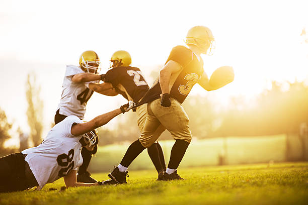 istock American football at sunset. 471914665