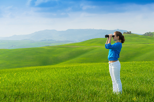 Young girl enjoying Tuscany views. Italy