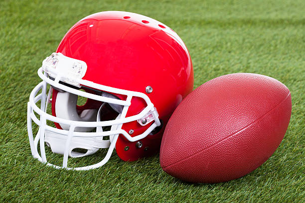 istock Football Helmet On Field 471916706