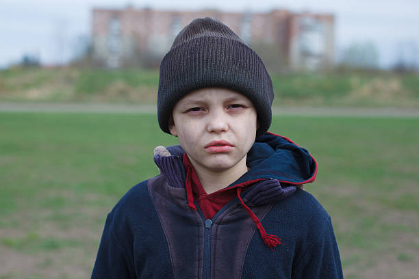 istock dramatic portrait of a homeless boy 471917996