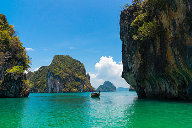 istock Traditional longtail boat near tropical island 471918158