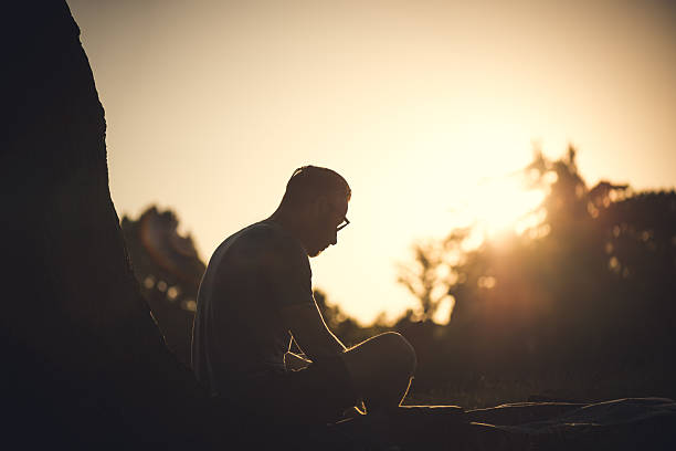 istock Young Men Reading Book at the Park 471918275