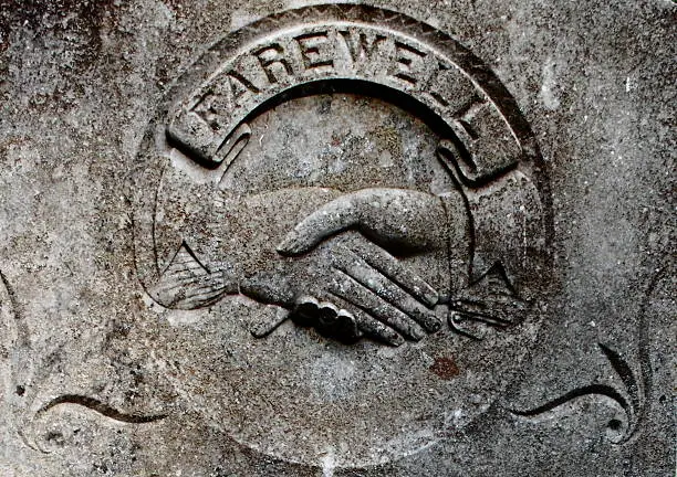 Photo of Historic Tombstone with Shaking Hands