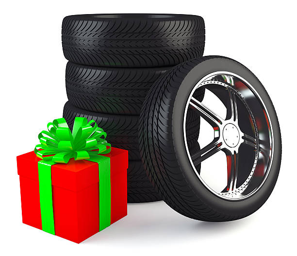 istock Car wheels with big red gift box 471918835