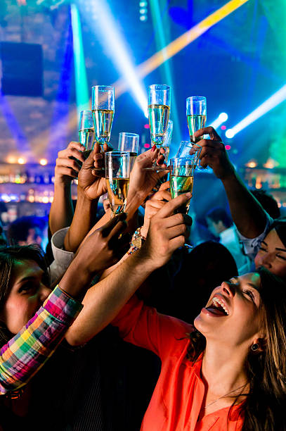 Friends toasting with champagne for the New Year at a nightclub