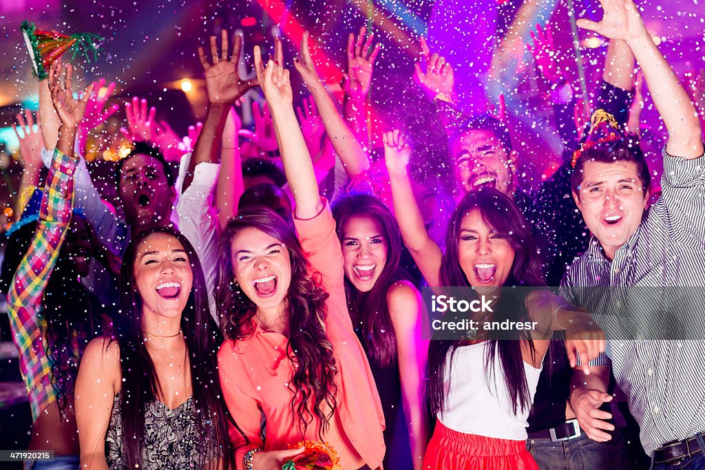 Group of people partying Happy group of people partying at a nightclub Dancing Stock Photo