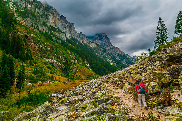 Female Hiker hiking Cascade Canyon in Grand Tetons