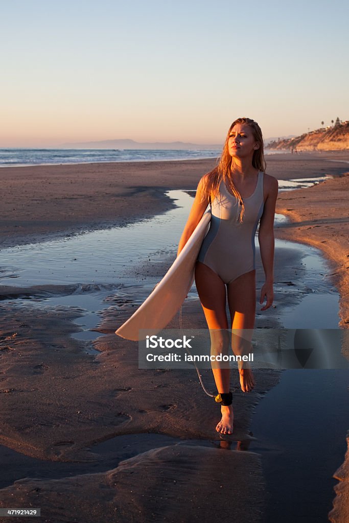 surfer girl surfer girl at the beach Beach Stock Photo