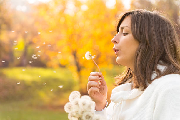 istock Young woman in the park 471922093