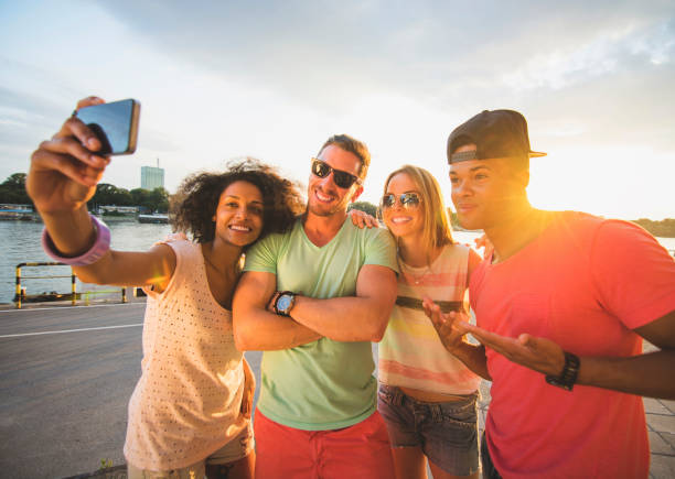istock Group of friends taking selfies 471922944