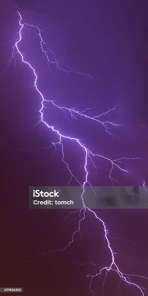 Night lightning bolt strike A powerful lightning bolt strike at night. Atmospheric Mood Stock Photo