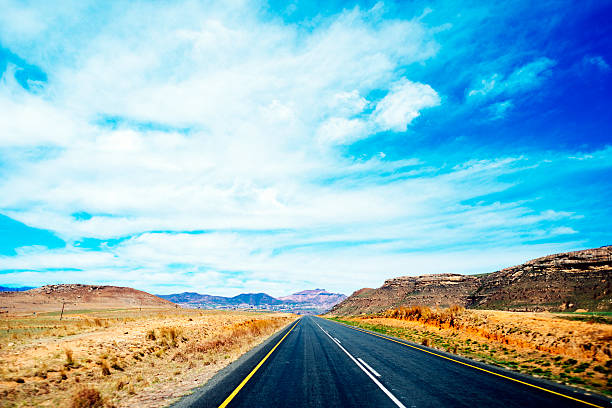 Long road Road to the mountains, Golden Gate National Park, South Africa golden gate highlands national park stock pictures, royalty-free photos & images