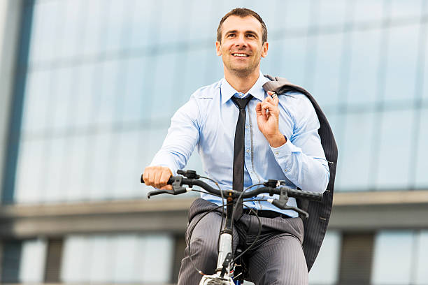istock Businessman riding a bicycle. 471924483