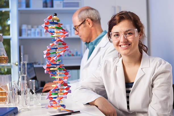 Subject: Portrait of a Chemistry science student in a laboratory with her teacher.