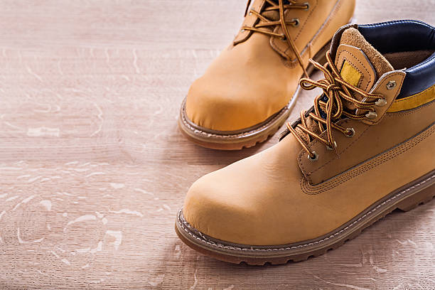 istock horizontal view very close up two working shoes On Wooden 471925850