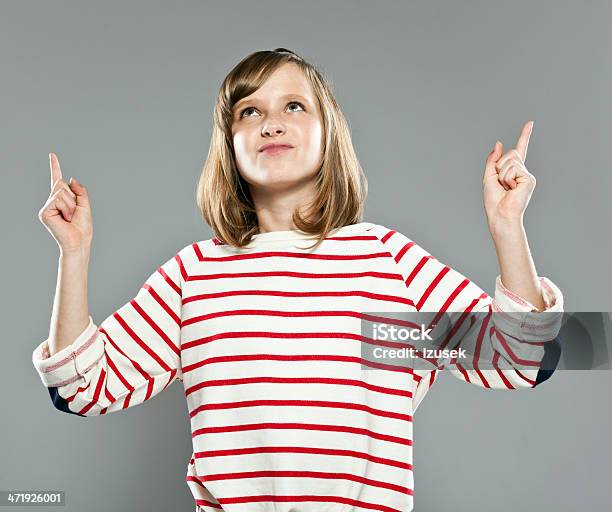 Cute Girl Pointing Stock Photo - Download Image Now - Girls, Looking Up, Teenage Girls