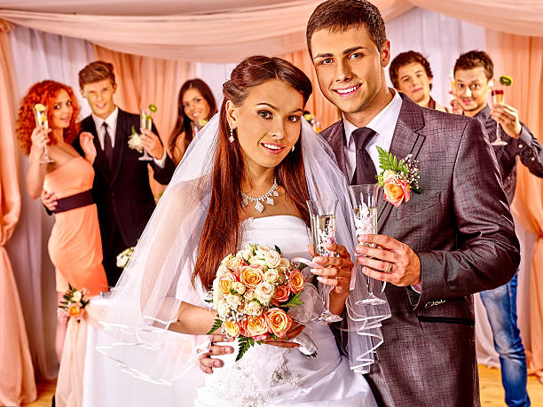 istock Wedding couple and guests drinking champagne 471926074