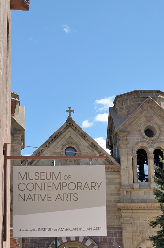Santa Fe, New Mexico, USA - March 18, 2013: The sign for the Museum of Contemporary Native Arts and St. Francis Cathedral in Santa Fe, New Mexico.