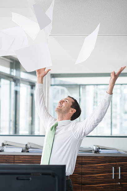 istock Businessman Throwing Paper In Office 471926985