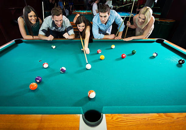 istock Friends playing snooker. 471927623