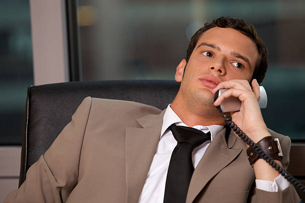 istock Businessman using telephone in an office 471928166