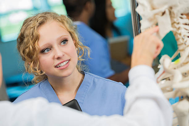 istock Curious medical or nursing student learning in college class 471929391
