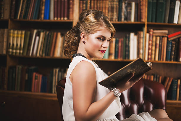 istock Beautiful young woman in library 471929643