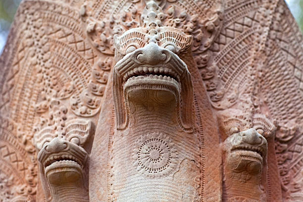 Ancient Statue of Nagas at Beng Mealea Temple over jungle, Cambodia. Beng Mealea is a temple in the Angkor Wat style located 40 km east of the main group of temples at Angkor.